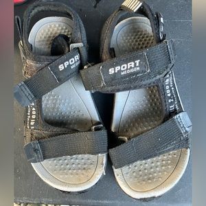 Black and gray Sports Medigen flip flops ( size 10.5 toddler )